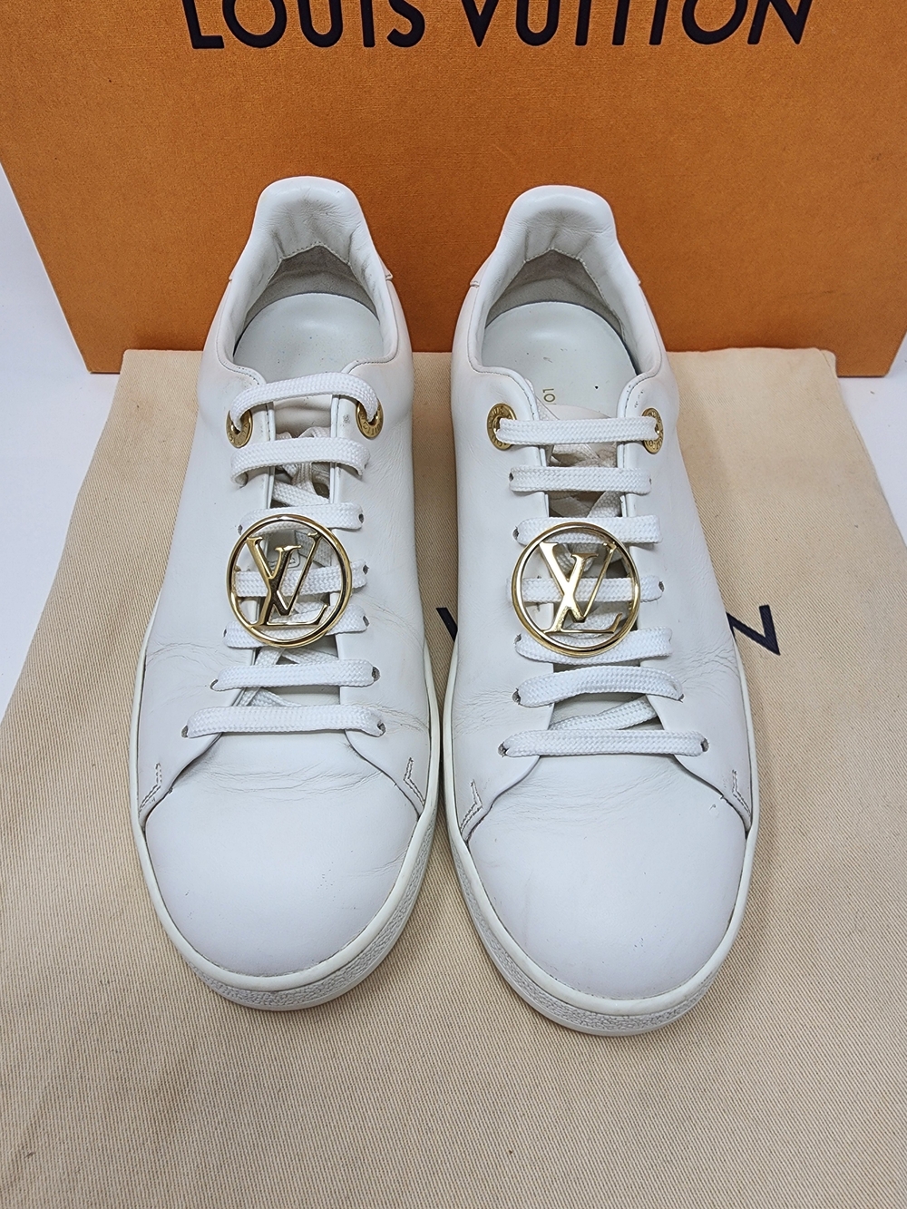 Louis Vuitton Women’s White Leather Low-Top Sneakers with Gold LV Medallion